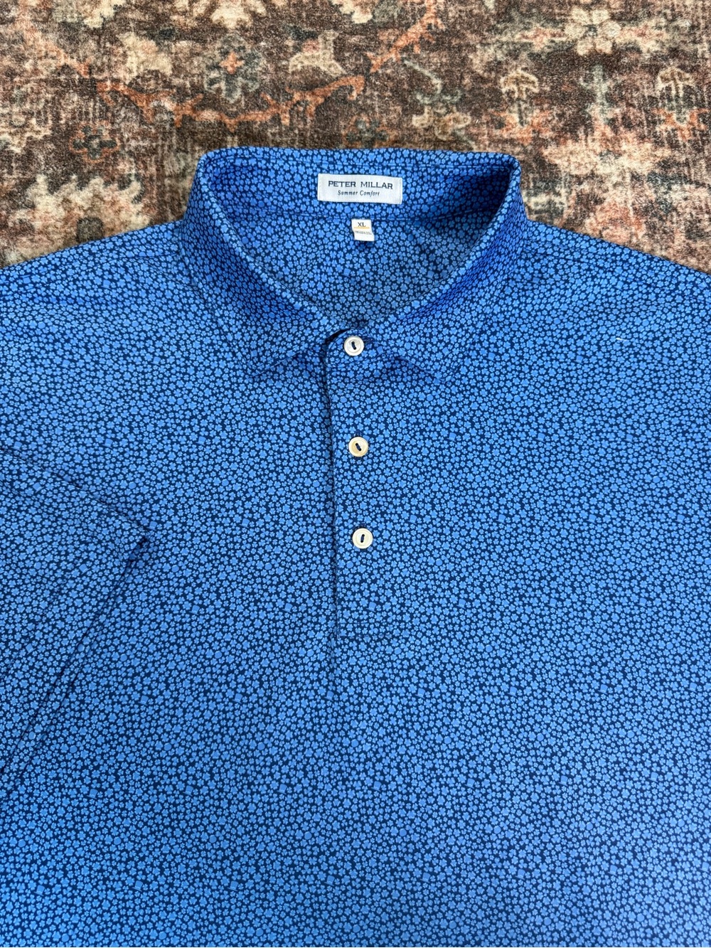 Peter Millar summer comfort Blue Floral Polo with crown emblem on the back XL
